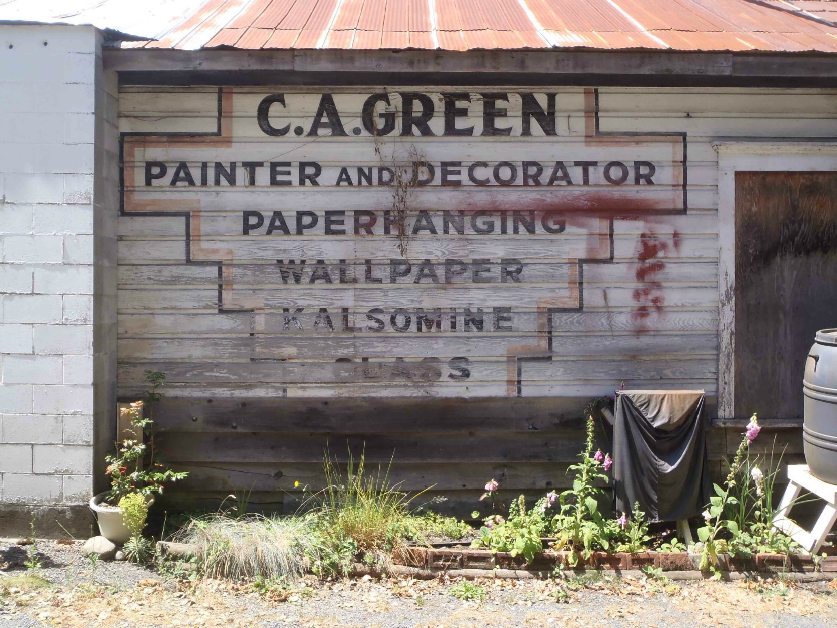 Sign for Claude Green's paint contracting business, circa 1940, is still visible on 161 Kenneth Street