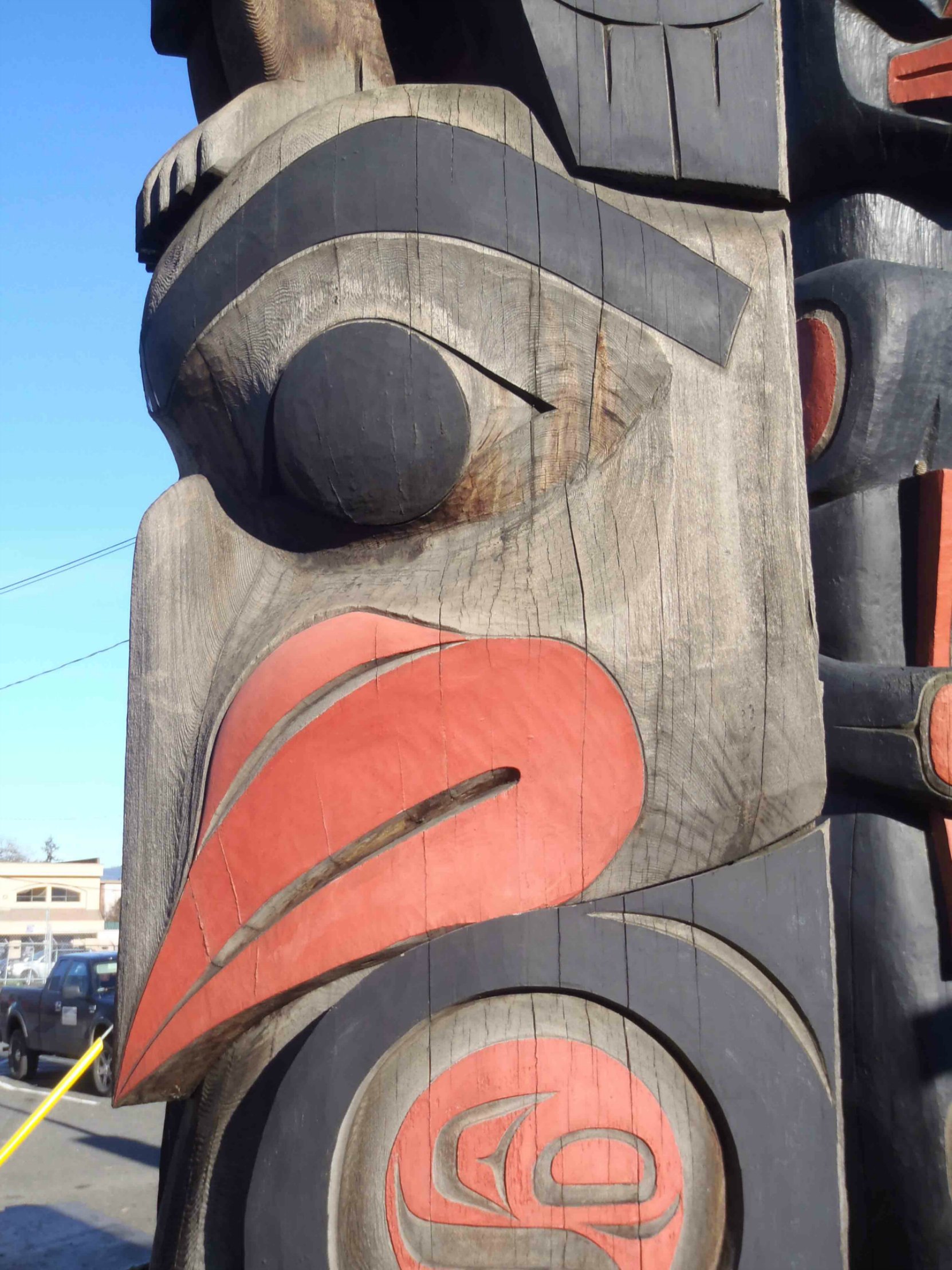 The Guardians pole, Eagle figure, face detail, Government Street at Kenneth Street, Duncan, B.C.