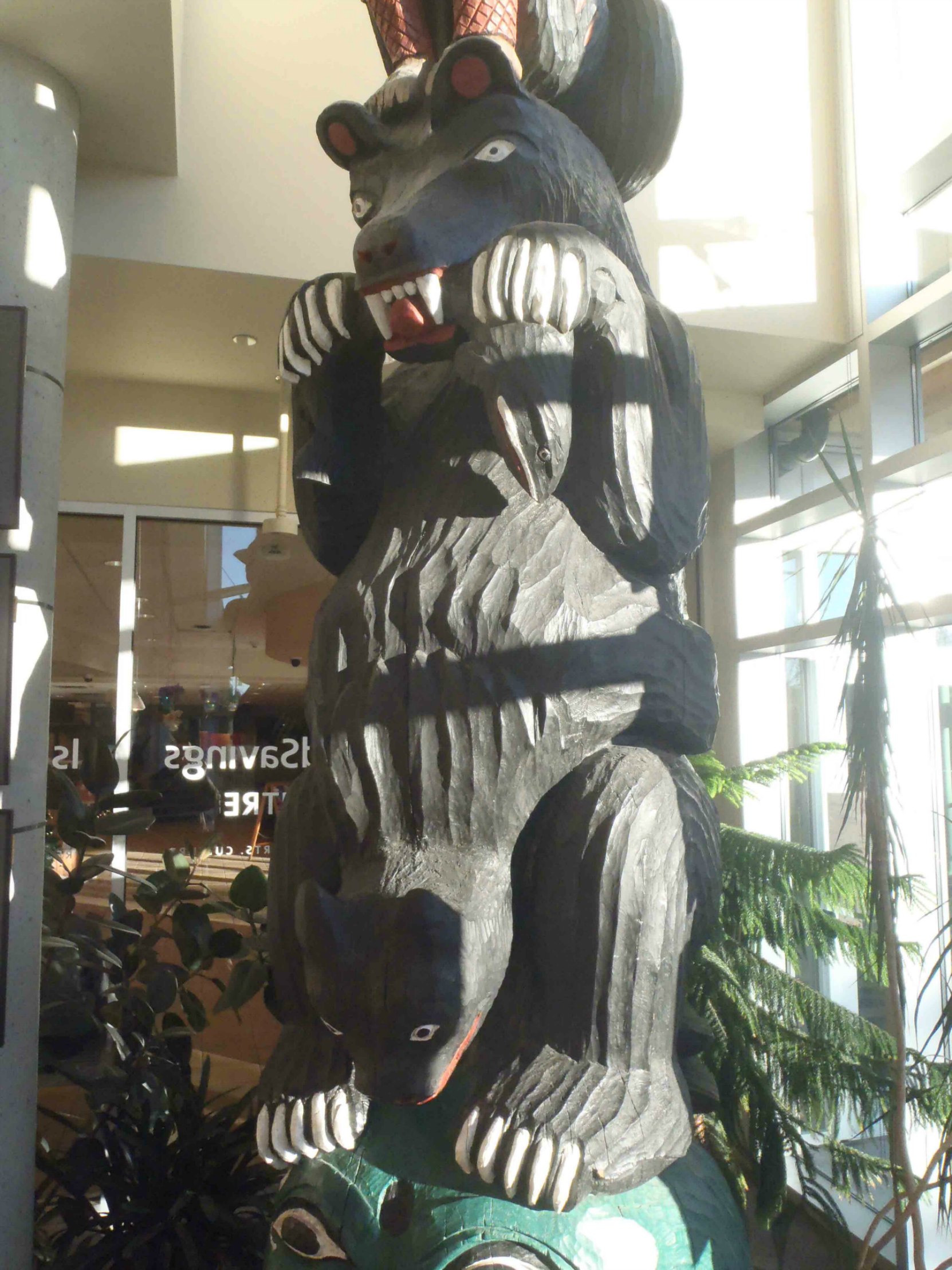 Provincial Route of the Totems Salish Bear pole, Salish Bear figure, displayed in Vancouver Island Public Library, Cowichan Branch.