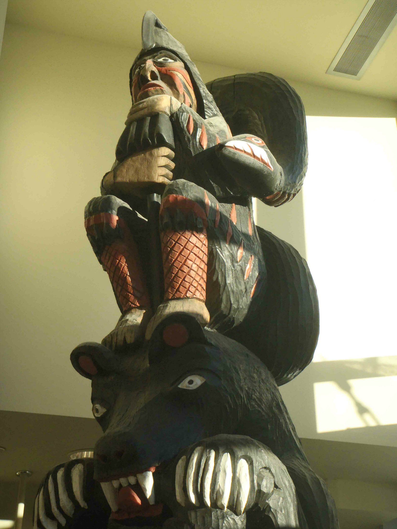Provincial Route of the Totems Salish Bear pole, Human figure, displayed in Vancouver Island Public Library, Cowichan Branch.