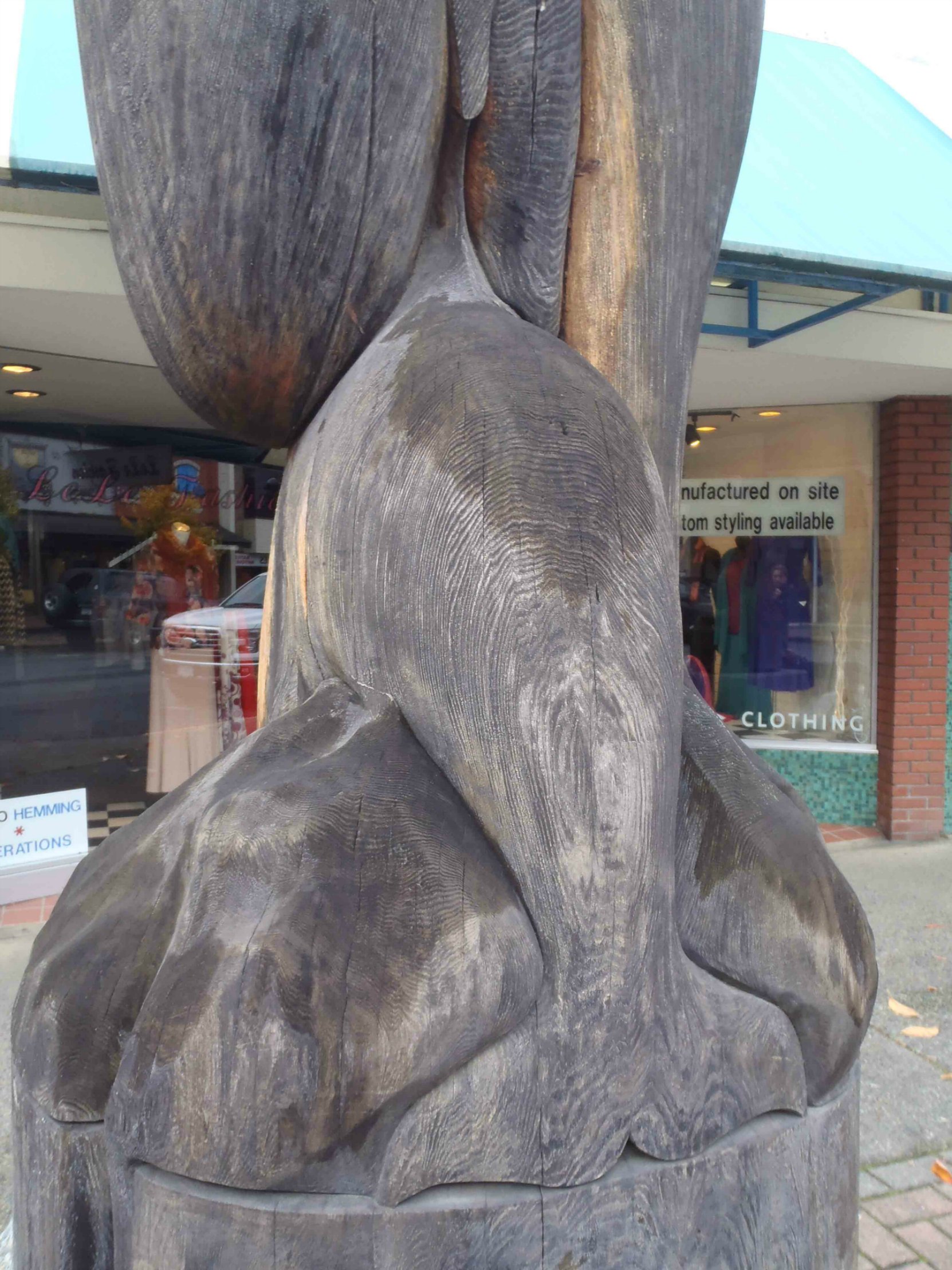 Transition totem pole, Killer Whale child figure, Station Street, Duncan, B.C.