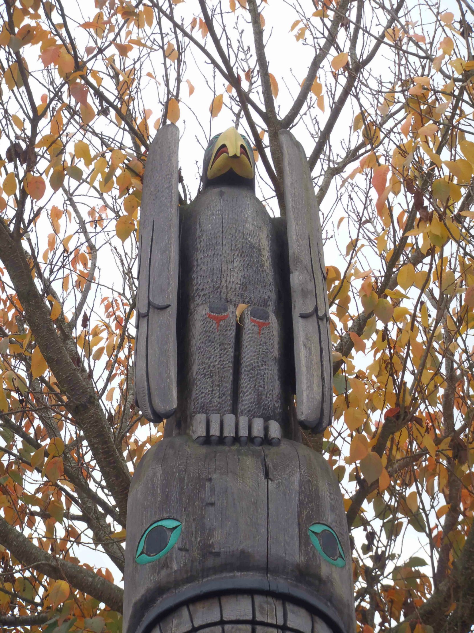 Tzinquaw Story totem pole, Thunderbird figure, Kenneth Street, Duncan, B.C.