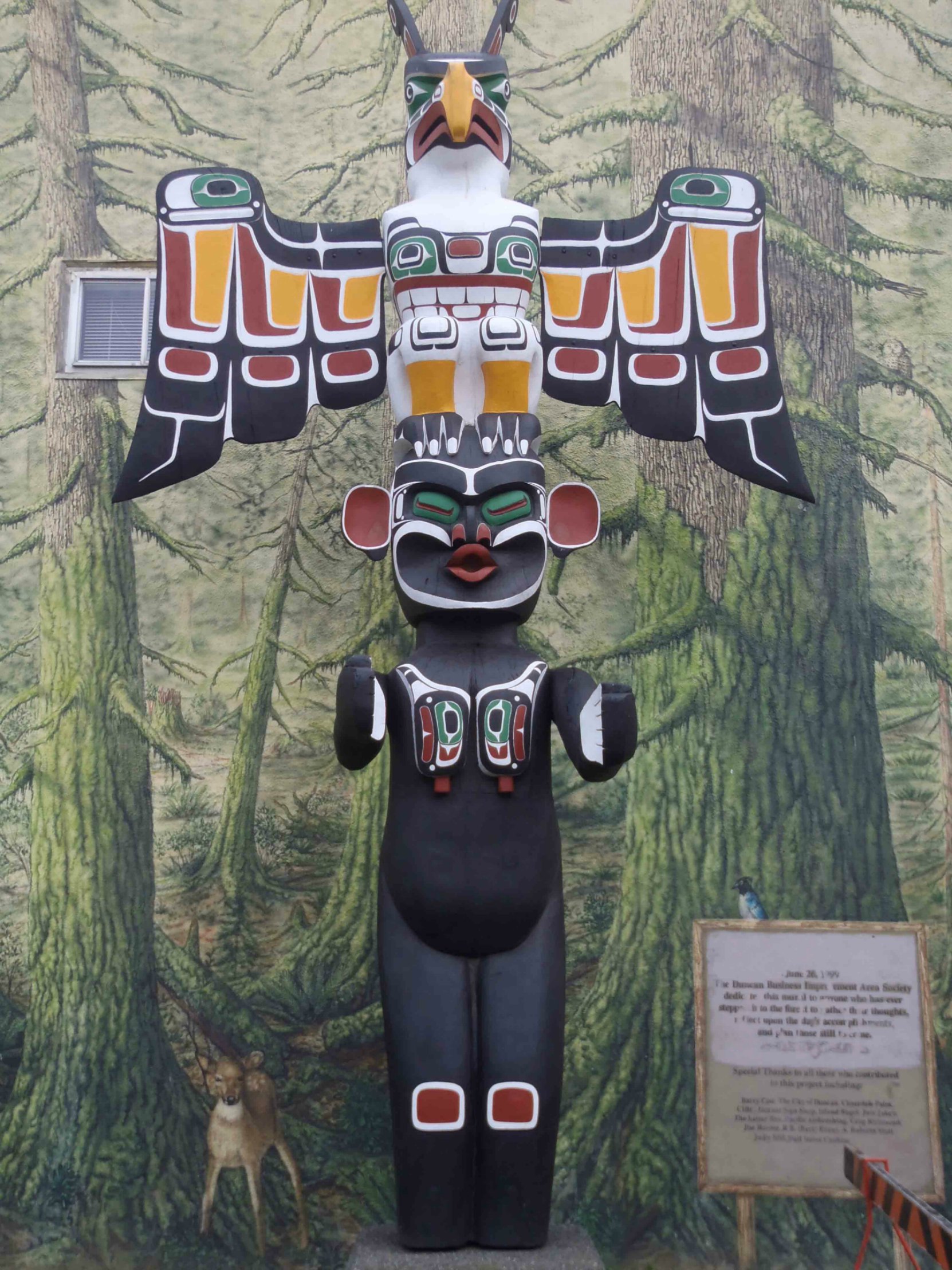 Thunderbird and Dzunuk'wa totem pole, Station Street at Craig Street, Duncan, B.C.