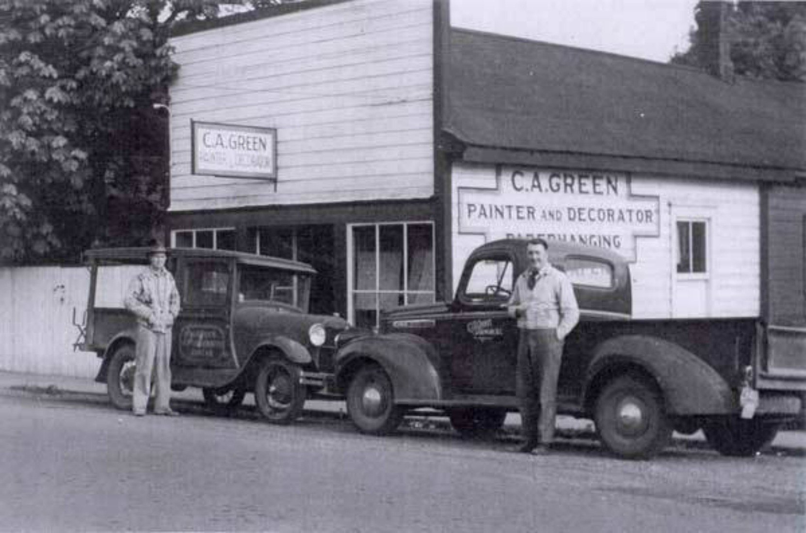 Claude Green in front of 161 Kenneth Street in the 1930s. The sign on the exterior wall behind Claude Green is still visible today.