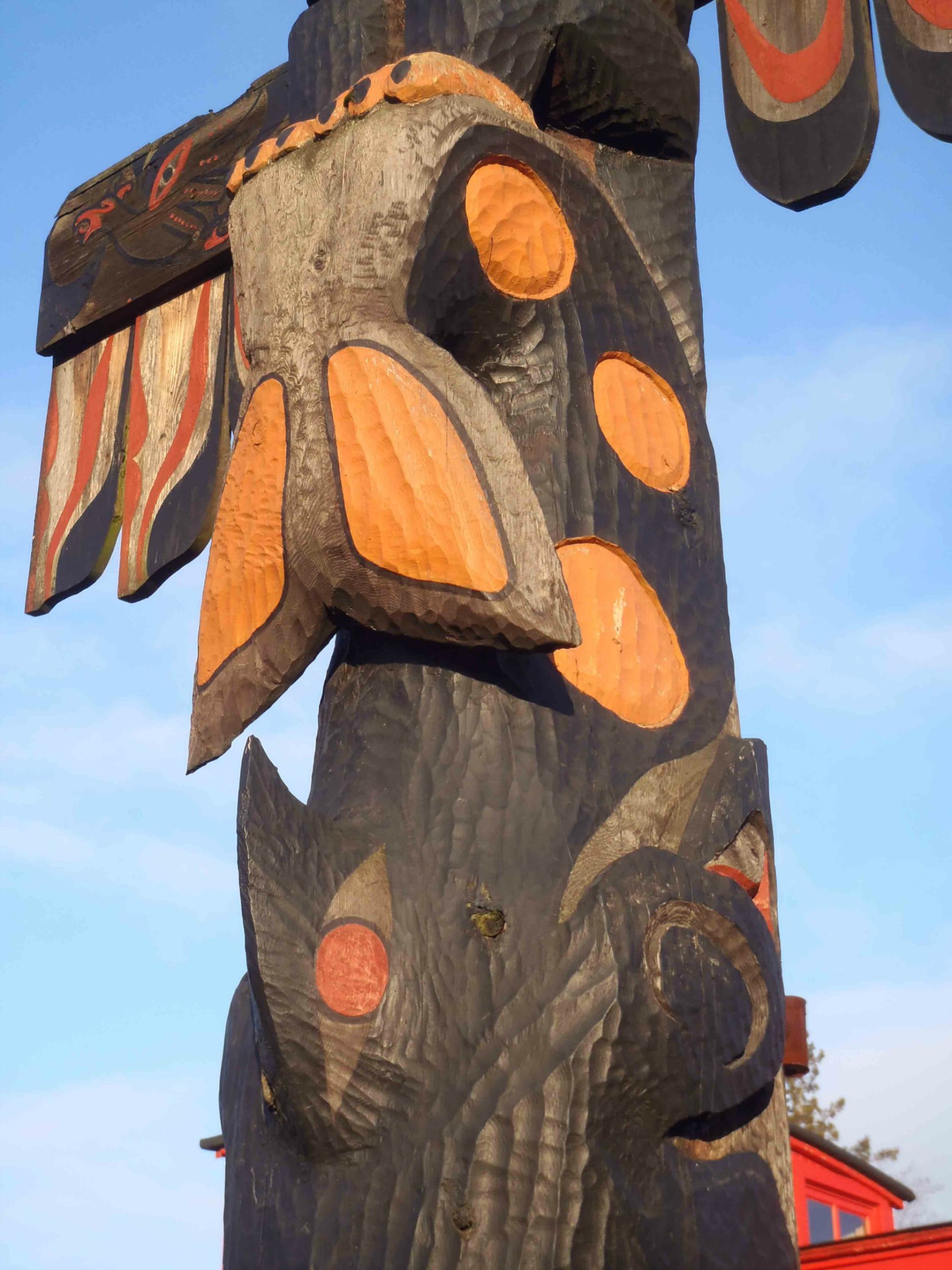 Pole of Wealth, Killer Whale figure detail. Canada Avenue at Kenneth Street