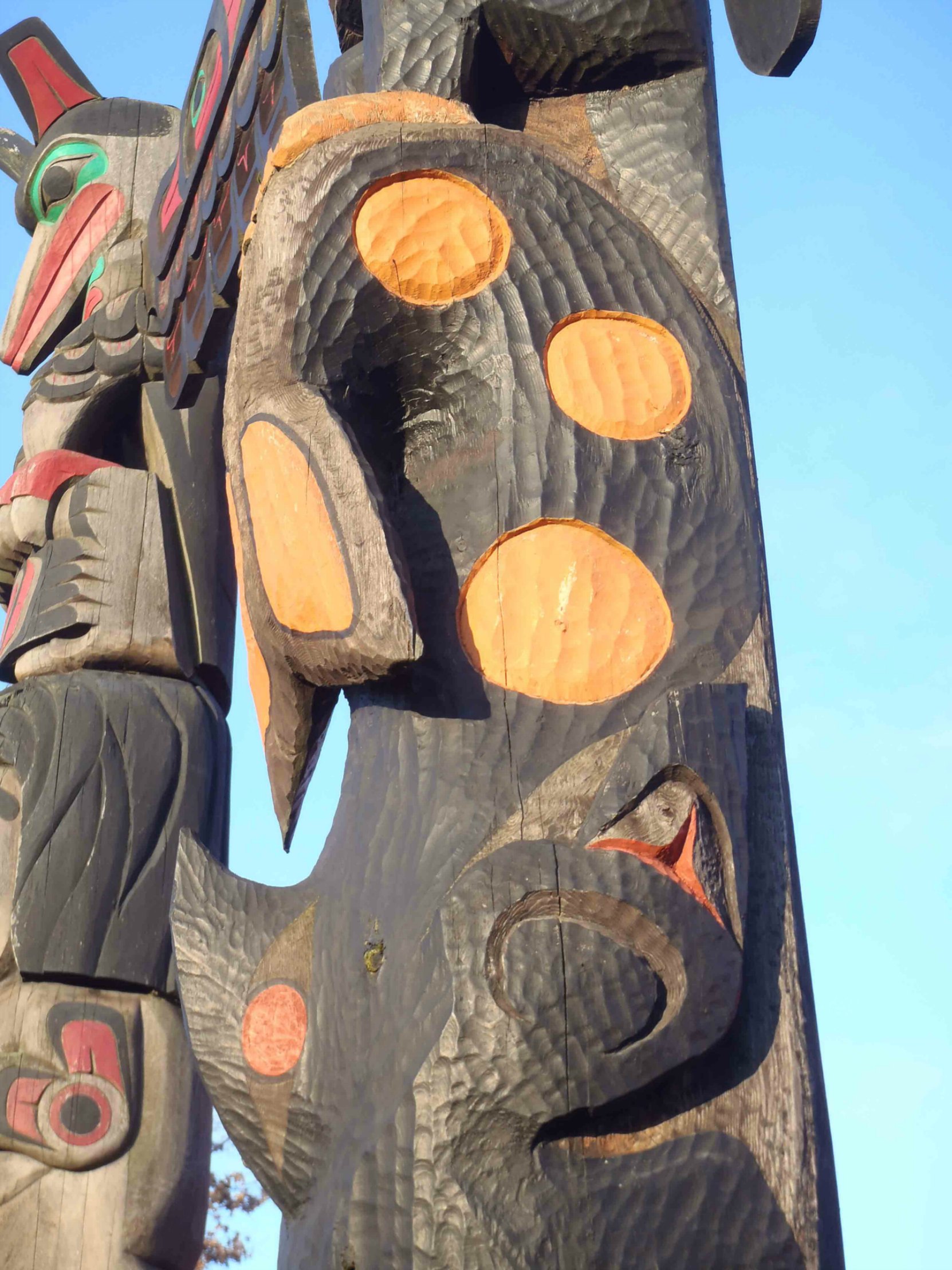 Pole of Wealth, Killer Whale figure detail. Canada Avenue at Kenneth Street