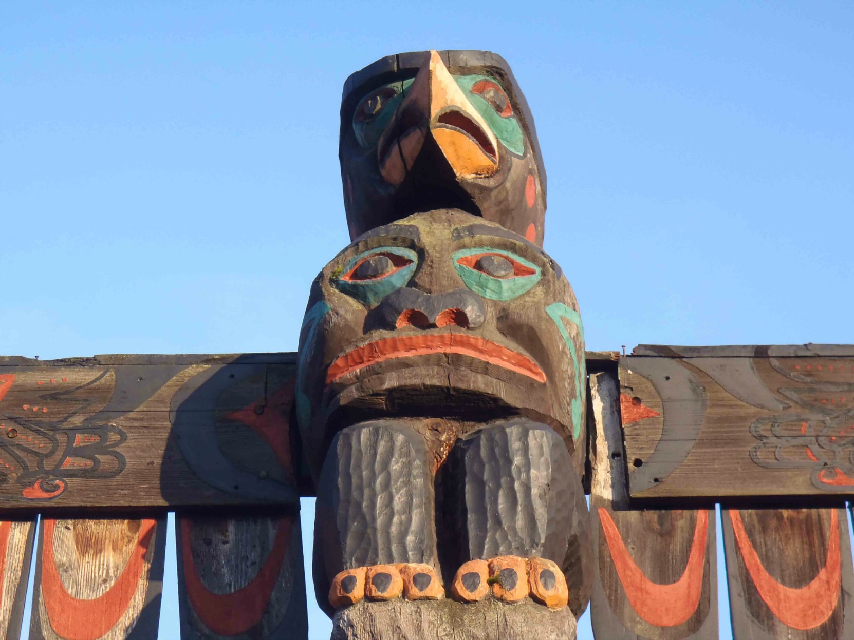 Pole of Wealth, Thunderbird and Spirit figures. Canada Avenue at Kenneth Street