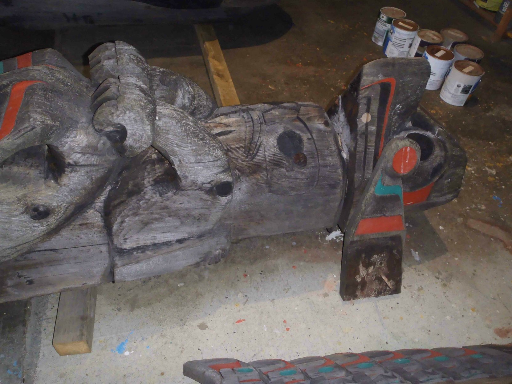 Pole of Wealth, Thunderbird figure, during restoration, 2016