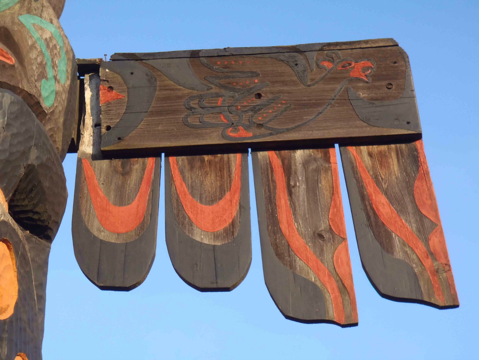 Pole of Wealth, Thunderbird figure wing detail. Canada Avenue at Kenneth Street