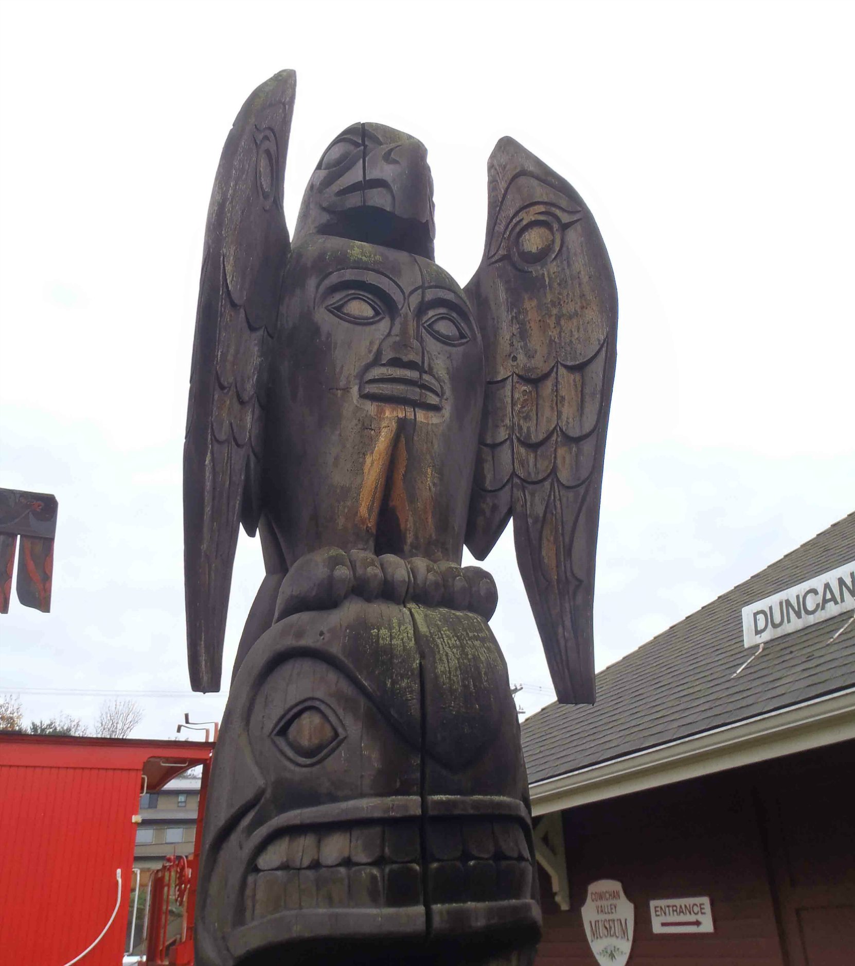 Transformation totem pole - Eagle and Killer Whale figure detail - Canada Avenue, Duncan