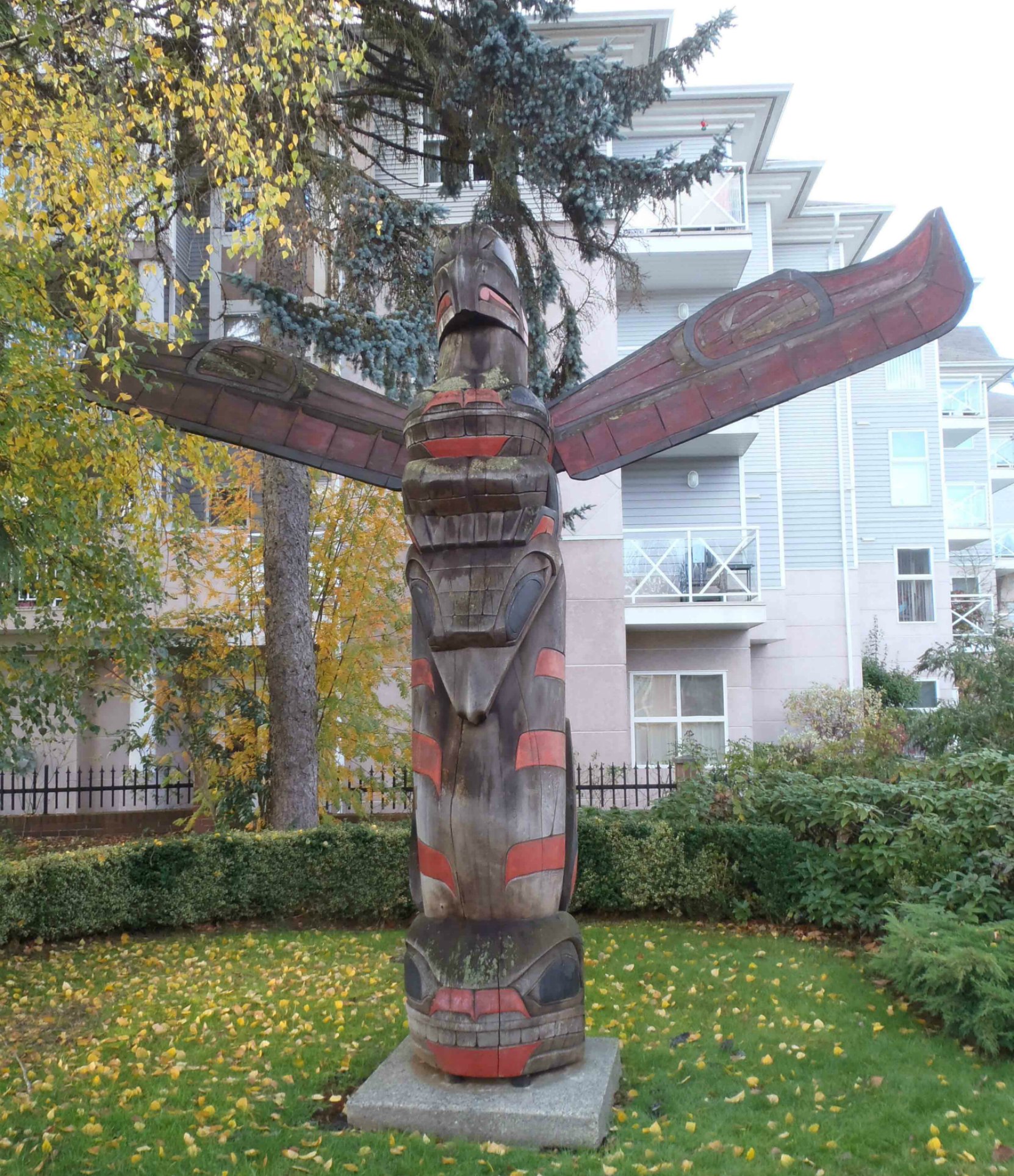 Transformation of Man totem pole, Government Street at E.J. Hughes Place