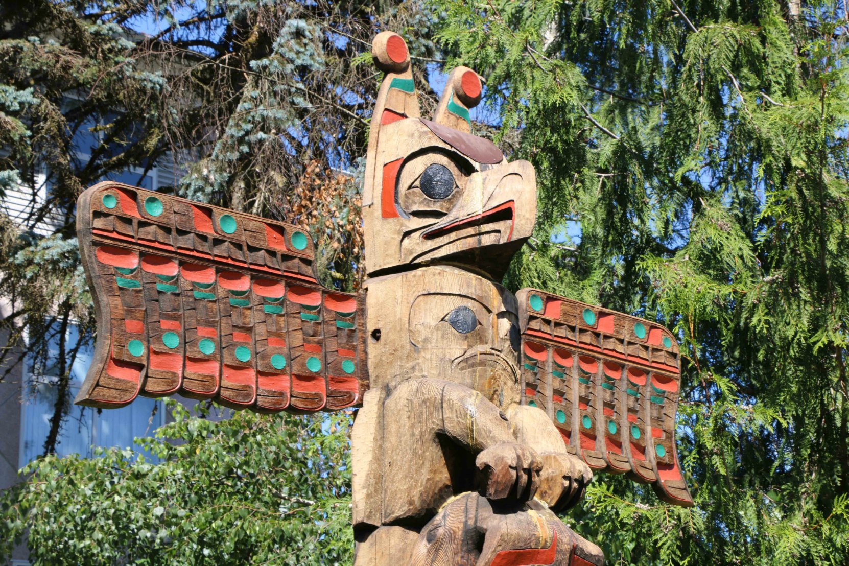 Pole of Wealth, Thunderbird figure, Government Street at E.J. Hughes Place.